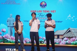 Young OVs engage in discussions in Vietnamese at the event. (Photo: VNA)