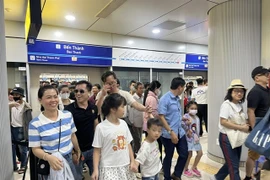 Passengers disembark at Ben Thanh station in District 1. The city's first metro commenced operations on December 22, following 17 years of planning and 12 years of construction. (Photo: VNA)