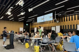 Children attend the event at Singapore-based Google office. (Photo: VNA)