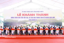 Prime Minister Pham Minh Chinh and delegates cut the ribbon to inaugurate the project to preserve and restore the Him Lam resistance centre relic site (Phase 2). (Photo: VNA)