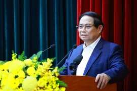 Politburo member, Prime Minister Pham Minh Chinh chairs the conference on February 23 (Photo: VNA)