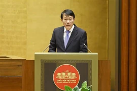 Minister of Public Security Luong Tam Quang presents the proposal on four draft laws at the National Assembly sitting on October 31. (Photo: VNA)