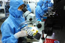 A camera component production line at a MCNEX VINA Company factory in Ninh Binh province, fully invested by the Korean company MCNEX Co., Ltd. (Photo: VNA)