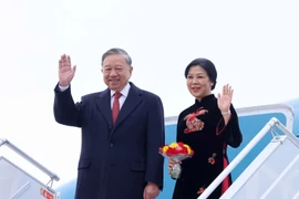 Party General Secretary To Lam and his spouse (Photo: VNA)