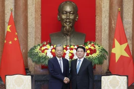 State President Luong Cuong (R) and Zhao Leji, member of the Standing Committee of the Political Bureau of the Communist Party of China (CPC) Central Committee and Chairman of the Standing Committee of the National People’s Congress (NPC) of China, in Hanoi on September 1 (Photo: VNA)