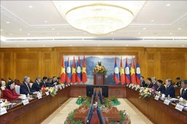 At the meeting between Party General Secretary To Lam and President of the Lao National Assembly Saysomphone Phomvihane (Photo: VNA)