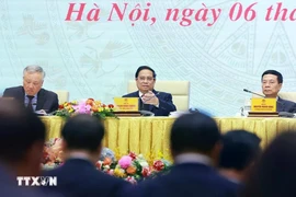 Prime Minister Pham Minh Chinh chairs a meeting to review the activities of the National Committee for Digital Transformation and Project 06. (Photo: VNA)