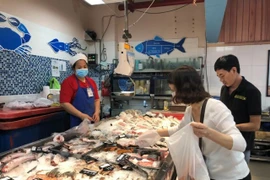 A woman goes to the supermarket in HCM City. (Photo: VNA)
