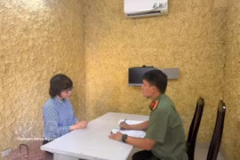 Nguyen Thuy Hang, Director of the Writers Association Publishing House, is questioned at the security agency for investigation under the Hanoi Department of Public Security. (Photo published by VNA)
