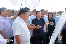 Deputy Prime Minister Nguyen Chi Dung and the working delegation inspect the construction site of Duong Dong 2 reservoir. (Photo: VNA)