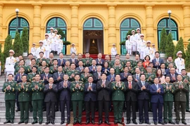 State President Luong Cuong and delegates attending the ceremony on November 4 to present appointment and promotion decisions to the military officers. (Photo: VNA)