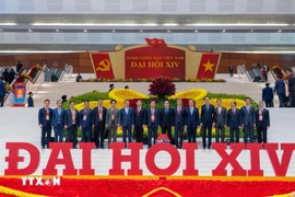 Ambassador Trinh Duc Hai (third from right) and other delegates attending the 14th National Party Congress (Photo: VNA)