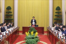 State President Luong Cuong chairs a meeting with the Presidential Office on December 31 to review its December performance and set key duties for January 2026. (Photo: VNA)