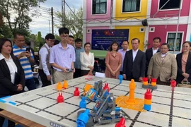 A challenge at the event (Photo: VNA)