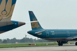 Two Vietnam Airlines aircrafts collide on a taxiway at the Noi Bai International Airport in Hanoi on June 27. (Photo courtesy of Noi Bai International Airport)