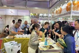 Visitors explore Vietnamese products at the sixth ANUGA Food and Beverage Exhibition. (Photo: Vietnam Trade Office in Brazil)