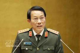 General Luong Tam Quang, Politburo member and Minister of Public Security, speaks at the national conference in Hanoi on February 7. (Photo: VNA)
