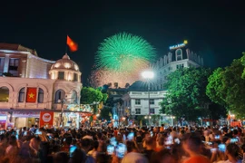 People in the capital enjoy a spectacular fireworks display over Hoan Kiem Lake to celebrate the 80th National Day on September 2. (Photo: VNA)
