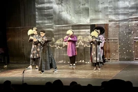 A scene from the musical "Le Dragon d'Or" (The Golden Dragon). (Photo: VNA) 