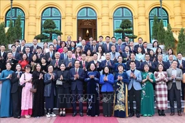 State Vice President Vo Thi Anh Xuan (eighth, left) and other delegates take group photo (Photo: VNA)