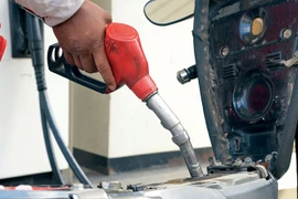 A motorist refuels at a station in Phnom Penh following a Ministry of Commerce warning against domestic fuel stockpiling. (Photo: Khmer Times)