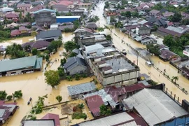 Flooded area in Aceh province, Indonesia on November 27. (Photo: Xinhua/VNA)