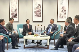 Prime Minister Pham Minh Chinh (L) and Kyrgyz President Sadyr Japarov at their meeting in Tianjin on September 1 (Photo: VNA)