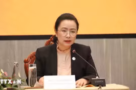 Manola Meuangmani, Director General of the Foreign Exchange Management Department under the Bank of the Lao PDR, speaks at the conference (Photo: VNA)