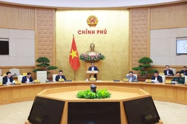 Prime Minister Pham Minh Chinh chairs Government monthly law-making session on March 19 (Photo: VNA)