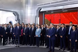 General Secretary of the Communist Party of Vietnam (CPV) Central Committee and State President To Lam (first, right, front row) listens to a presentation about the China-ASEAN AI Application Cooperation Centre (Photo: VNA)