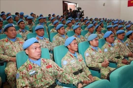 Members of the missions of Engineering Unit Rotation 3 and Level-2 Field Hospital Rotation 6 at the conference (Photo: VNA)