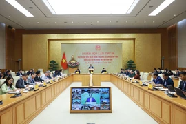 Prime Minister Pham Minh Chinh chairs the 28th meeting of the national steering committee for combating IUU fishing on December 30. (Photo: VNA)