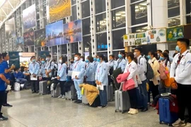 Vietnamese workers prepare to go abroad for working. (Photo: VietnamPlus)