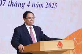 Prime Minister Pham Minh Chinh speaks at the meeting. (Photo: VNA)