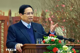 Prime Minister Pham Minh Chinh extends new year wishes to the banking sector at a meeting on February 3. (Photo: VNA)
