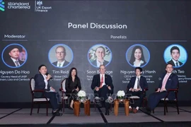 A panel discussion at the event (Photo: VNA)