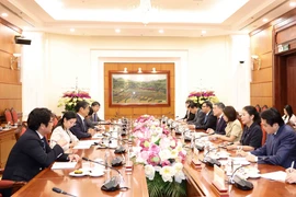 Politburo member, Secretary of the Party Central Committee and Chairman of its Organisation Commission Le Minh Hung (fourth, right) and Japanese Ambassador to Vietnam Ito Naoki (third, left). (Photo: VNA)
