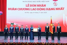 PM Pham Minh Chinh bestows the first-class Labour Order on the SBV (Photo: VNA)