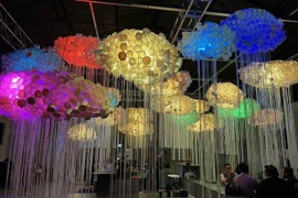 Paper cups are used to make unique chandeliers displayed at the Bandung Design Biennale 2025. (Photo: VNA)