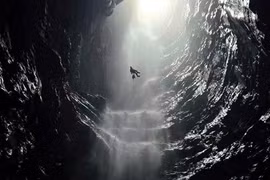 A newly discovered cave in Phong Nha – Ke Bang National Park features an exceptionally rare waterfall. (Photo: tuoitre.vn)