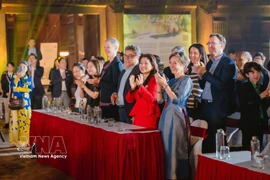 Polish Ambassador to Vietnam Joanna Skoczek (R) attends a cultural event in Vietnam (Photo: VNA)