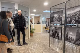 Visitors at the photo exhibition “The Sea Within Us” (La mer en nous) at the City Hall of Châteaudun. (Photo: VNA)
