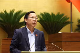 Phan Van Mai, Chairman of the National Assembly’s Committee for Economic and Financial Affairs, delivers a report presenting explanations, feedback, and revisions to the amended draft Law on Corporate Income Tax. (Photo: VNA) 