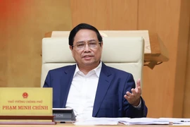 Prime Minister Pham Minh Chinh addresses the Government’s law-making session in Hanoi on July 23. (Photo: VNA)