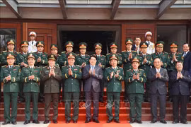 State President Luong Cuong (front, centre) and officers of the Special Operation Arms in a group photo on January 20. (Photo: VNA)