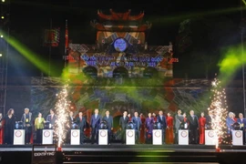 Delegates press the buttons to kick off the event (Photo: VNA)