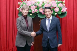 Minister of Public Security General Luong Tam Quang (R) and Singapore’s Minister for Digital Development and Information Josephine Teo in Hanoi on January 15 (Photo: VNA)