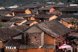 Houses feature rammed-earth walls and yin-yang roof tiles in Lo Lo Chai (Photo: VNA)