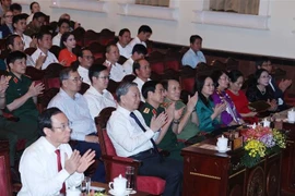 Party General Secretary To Lam and officials attend the “Ban giao huong hoa binh” (symphony of peace) concert on April 21 evening. (Photo: VNA)