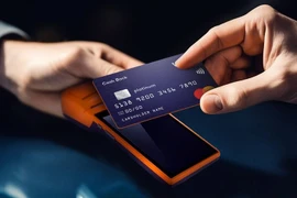 Cashless payment becoming more popular in Vietnam. (Photo: VietnamPlus)